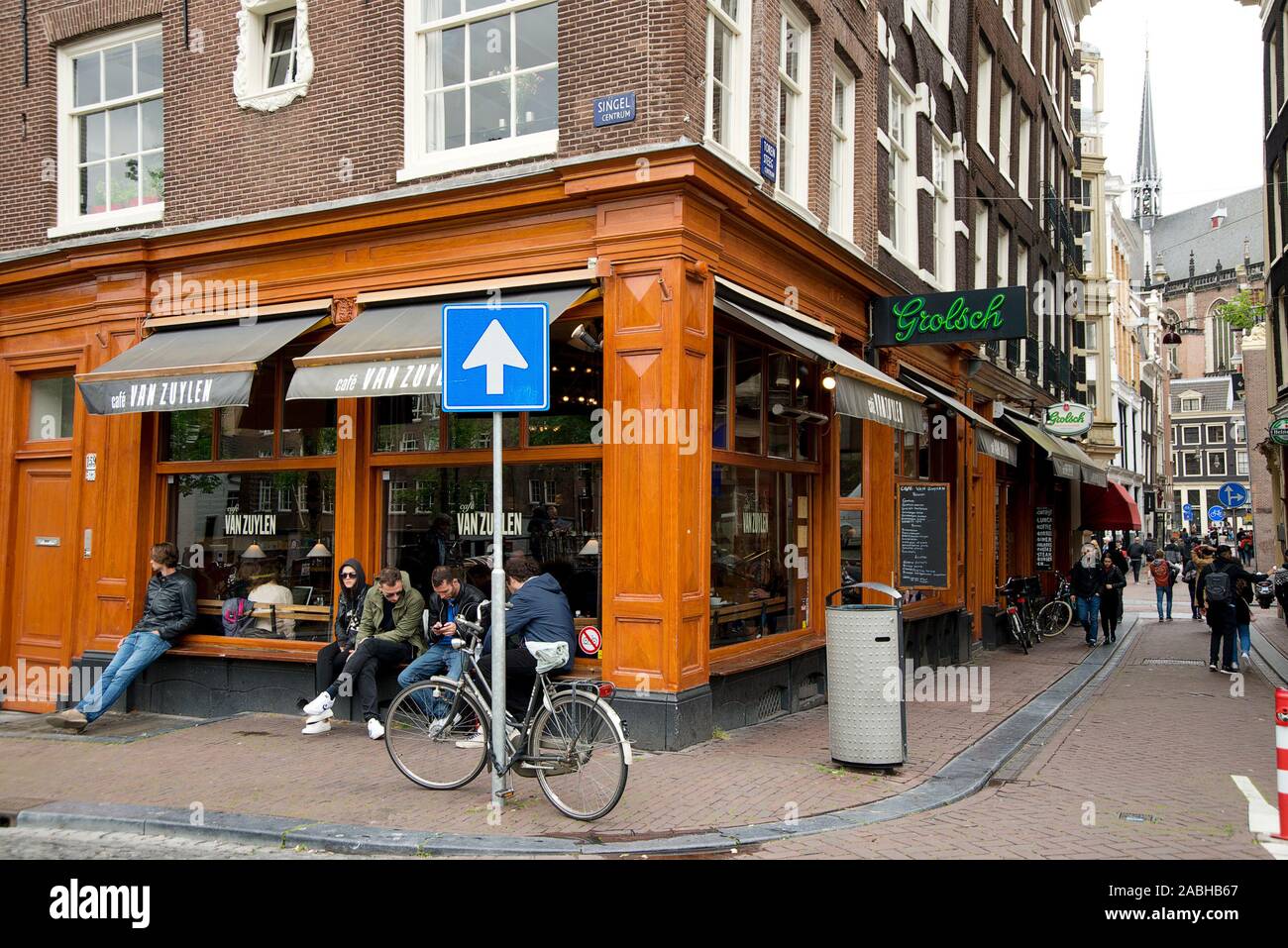 Outside Of Beautiful Cafe Van Zuylen Amsterdam Bar On Street Corner With Bicycle And People Sitting On Window Blue One Way Sign With Bicycle Stock Photo Alamy