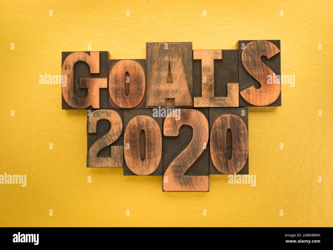 Goals 2020, phrase written with vintage letterpress printing blocks on gold colored background Stock Photo