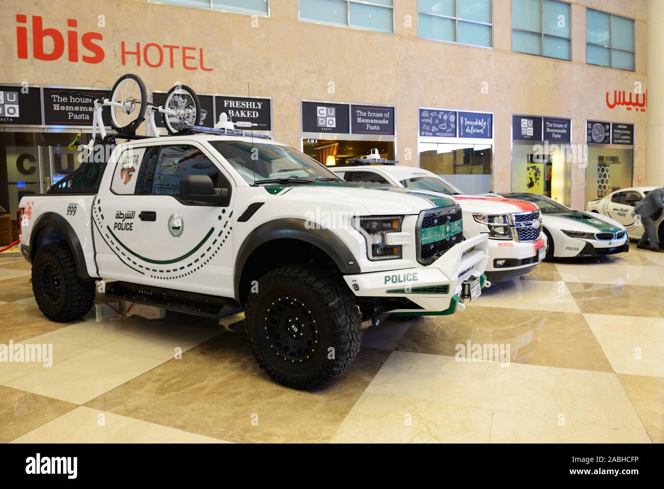 DUBAI, UAE - NOVEMBER 16: The Ford Raptor of Dubai Police, Chevrolet Tahoe rescue cars, BMW i8 electric car are on Dubai Motor Show 2019 on November 1 Stock Photo