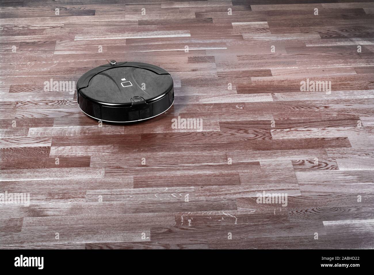 Robot Vacuum Cleaner On Dark Laminate Floor Modern Smart Home