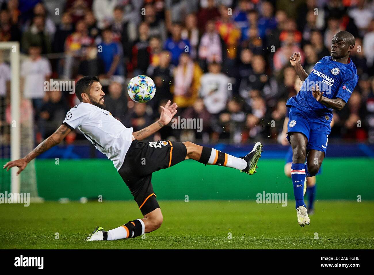 Mestalla, Valencia, Spain. 27th Nov, 2019. UEFA Champions League Footballl, Valencia versus Chelsea; Ngolo Kante of Chelsea centers challenged by Ezequiel Garay of Valencia CF - Editorial Use Credit: Action Plus Sports/Alamy Live News Stock Photo