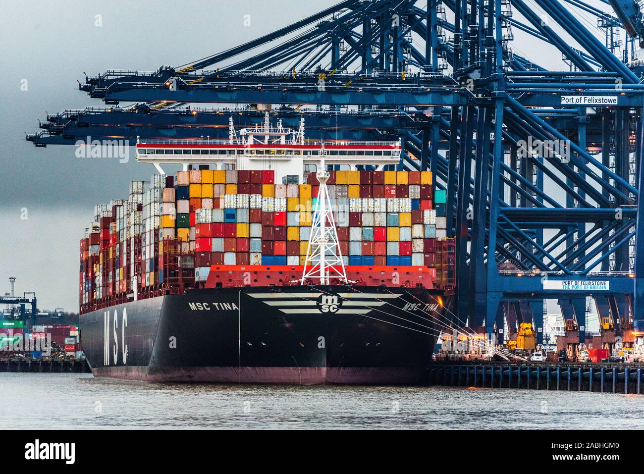British Trade at Felixstowe Port - MSC Tina Container Vessel unloads containers at the Port of Felixstowe. Stock Photo