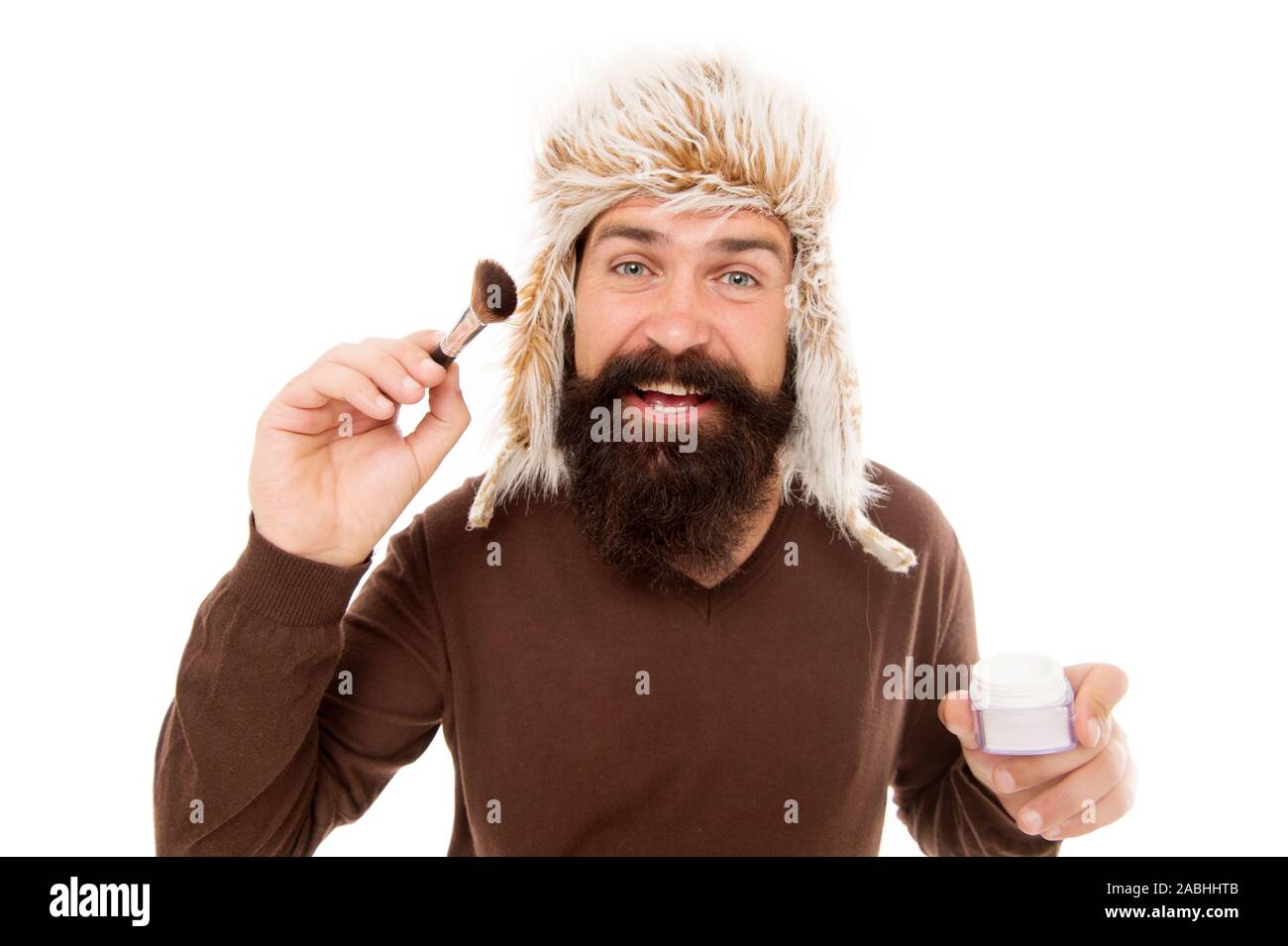 Freak visagiste. Applying makeup face tone. Powder cosmetics. Man bearded  fashion stylist wear hat hold brush for applying makeup. Eccentric guy with  beard. Makeup and greasepaint. Stylist career Stock Photo - Alamy