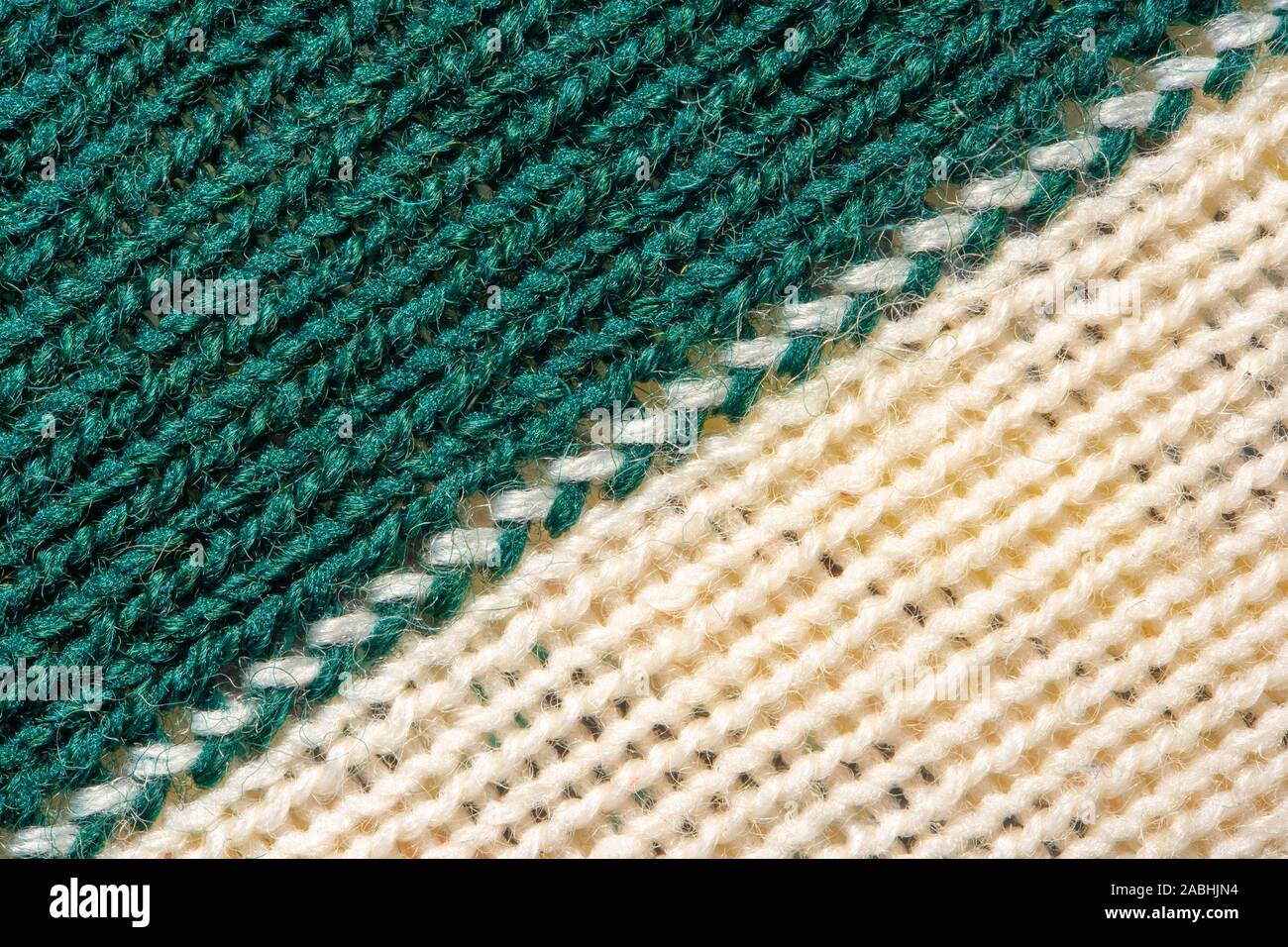 Green and white knitting wool texture. Cloth background close up Stock Photo