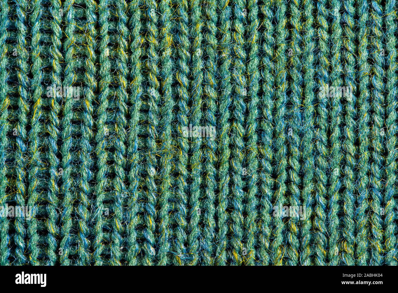 Green knitting wool texture. Cloth background close up Stock Photo