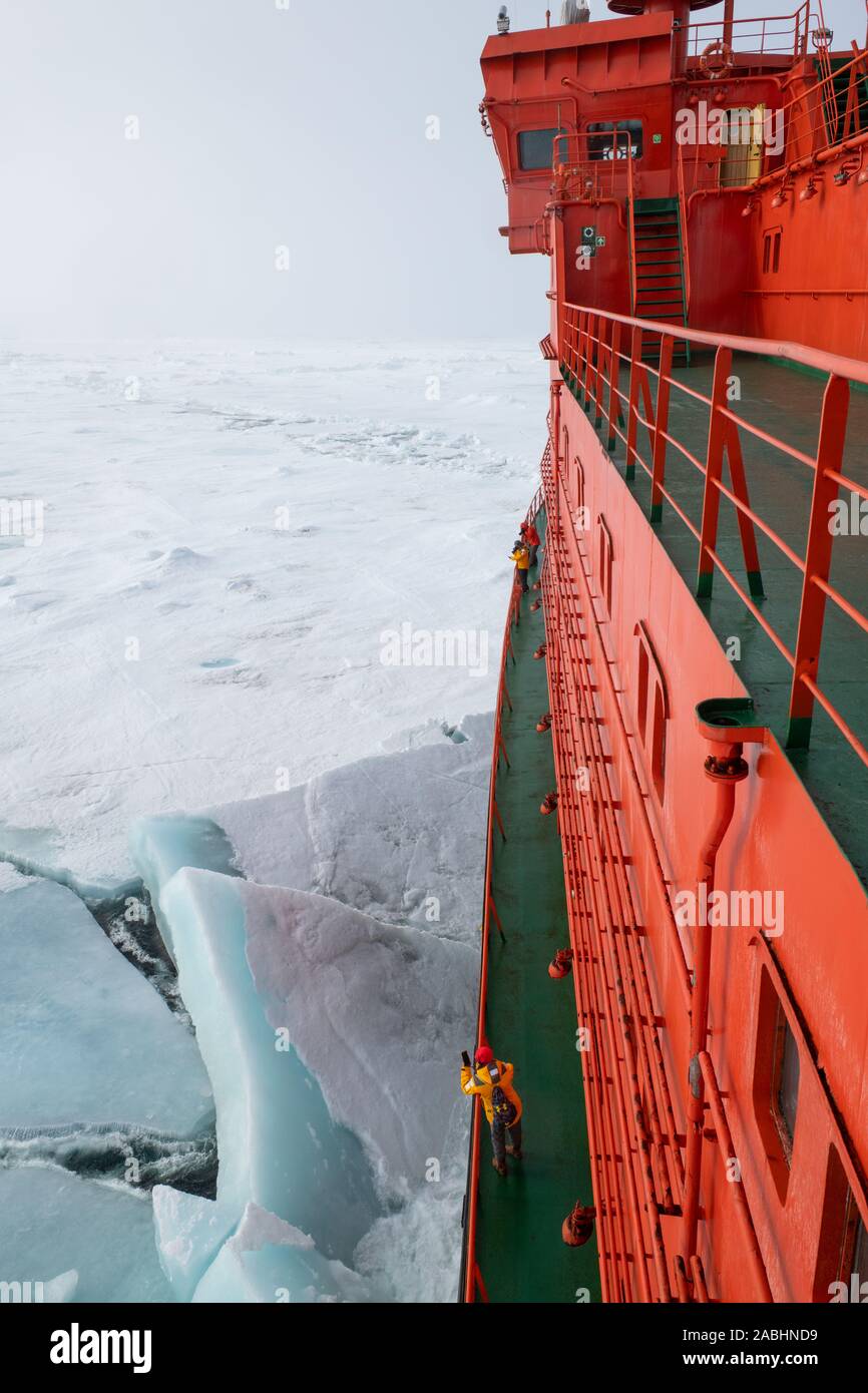 Russia, High Arctic. Crashing through thick sea ice at 89 degrees north as seen from the deck of Russian icebreaker, 50 Years of Victory. Stock Photo