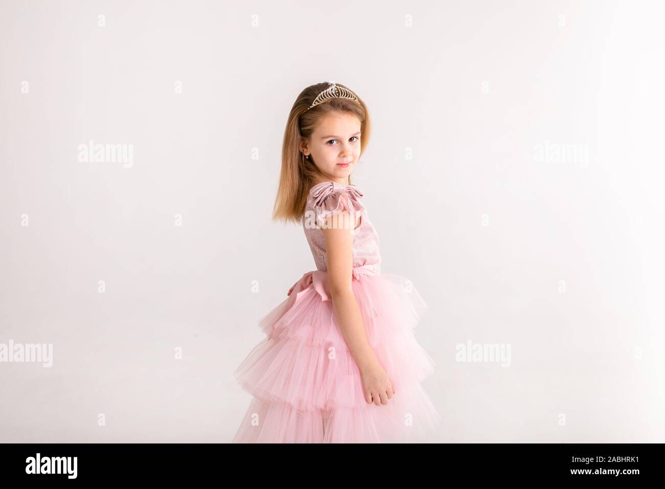 Beautiful little princess dancing in luxury dress Stock Photo - Alamy