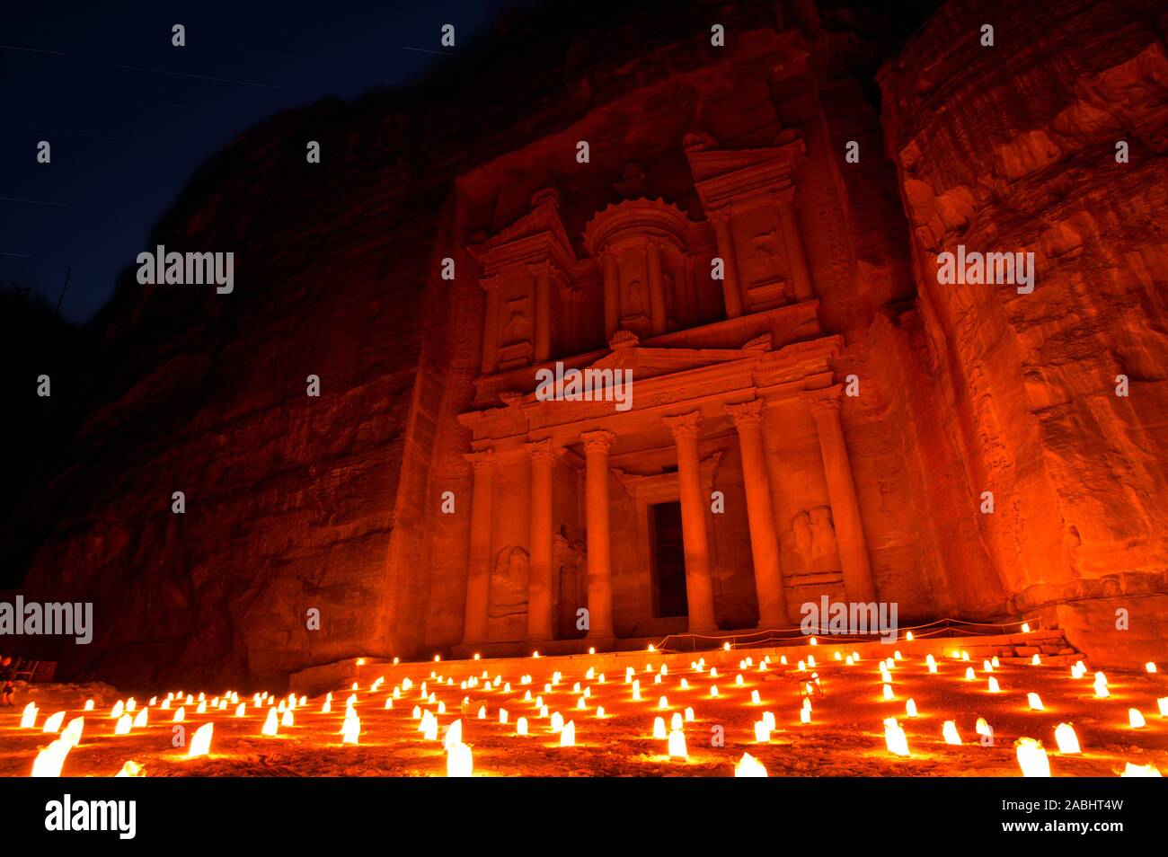 Treasury (Al Khazneh) of Petra Ancient City Illuminated by Candles, Jordan Stock Photo