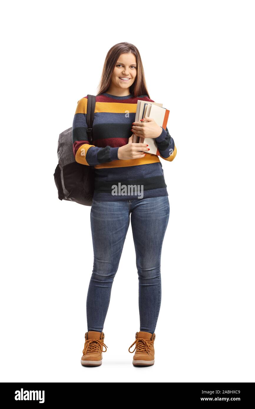 Full length portrait of a female student posing and holding books ...