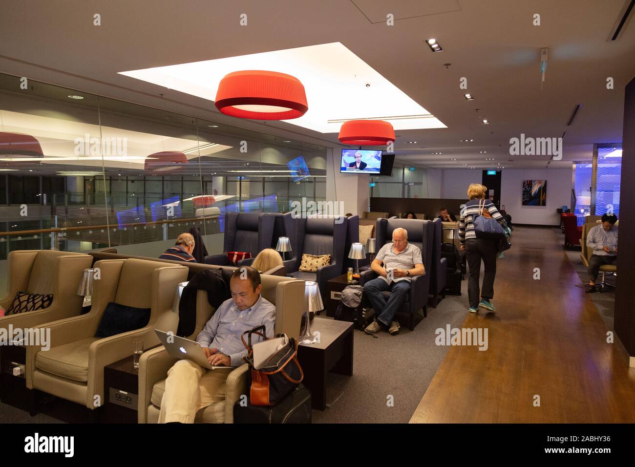 Business Class lounge; People sitting in the Quantas business class lounge, Changi airport