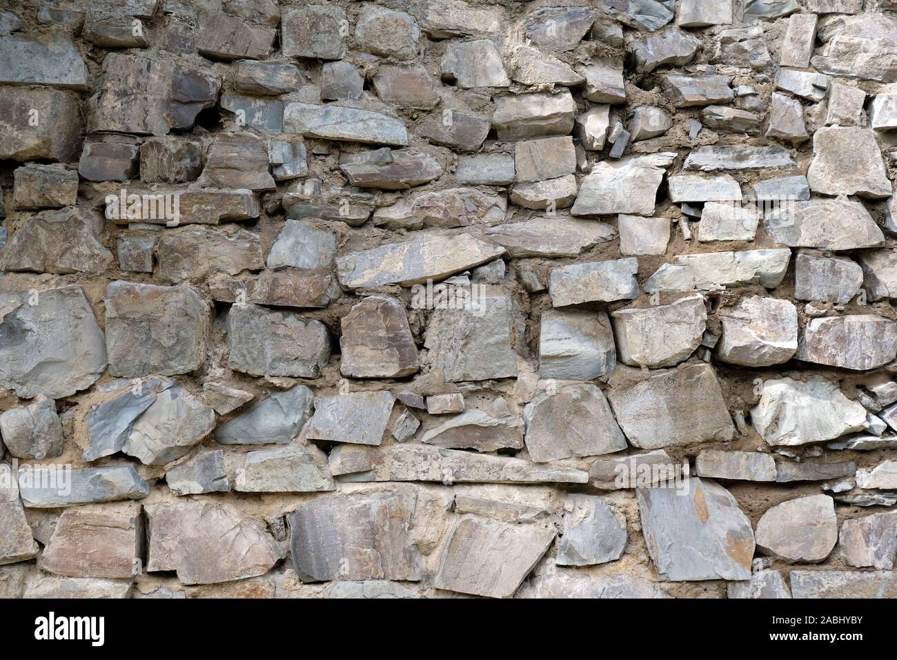 Wall from large stone texture basalt. Stone wall background. Large