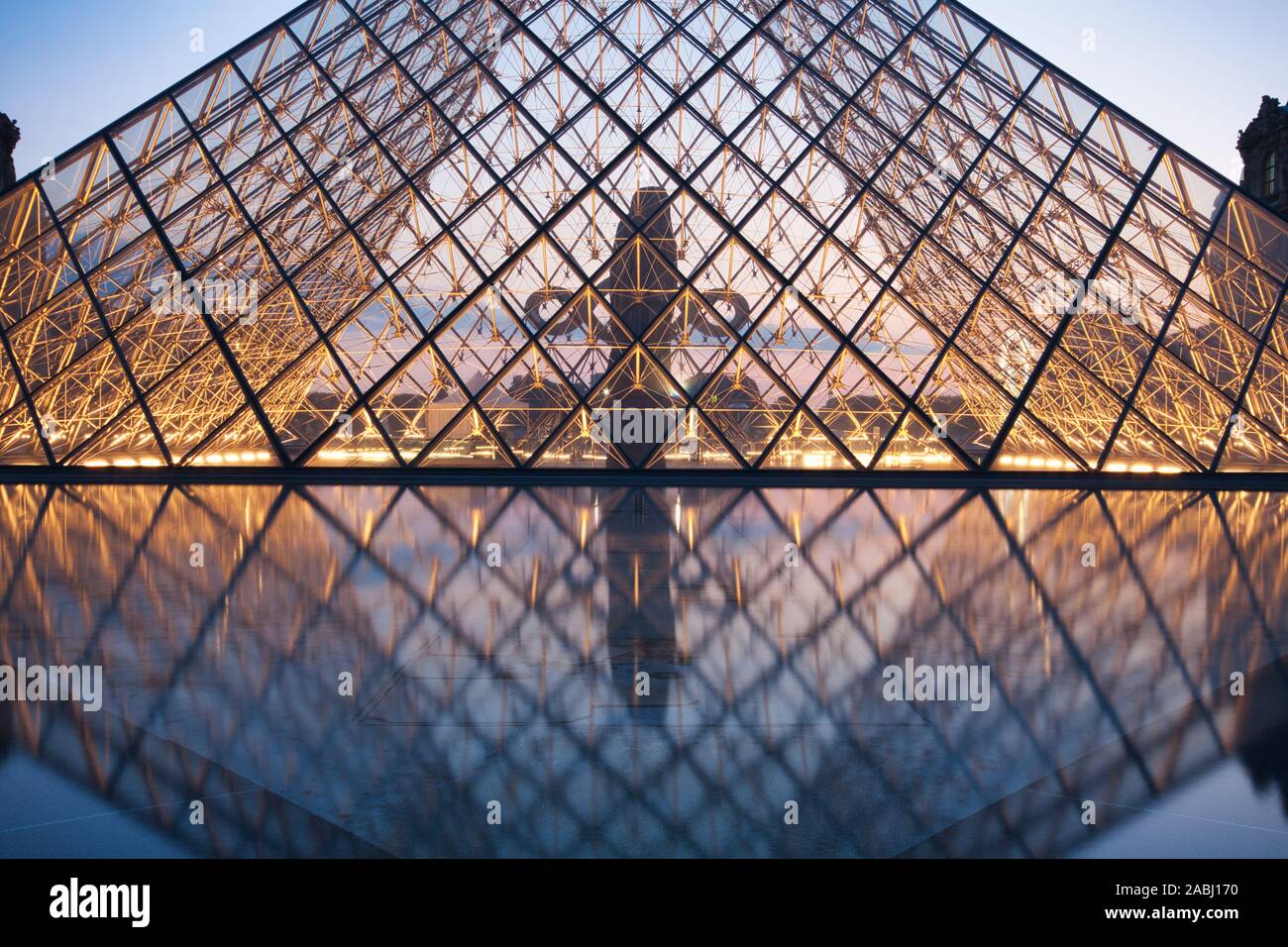 PARIS, FRANCE JULY 6 The Louvre Pyramid at dusk during the