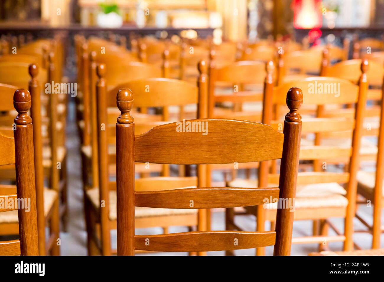 Wooden chairs in hall of old church, Europe Stock Photo - Alamy