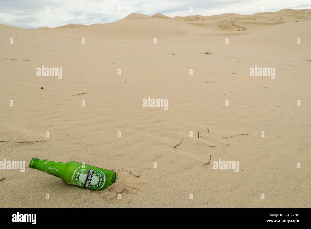 Beer Rings Polution glass bottle, Heineken Pilsener beer. green bottle pollution and ...