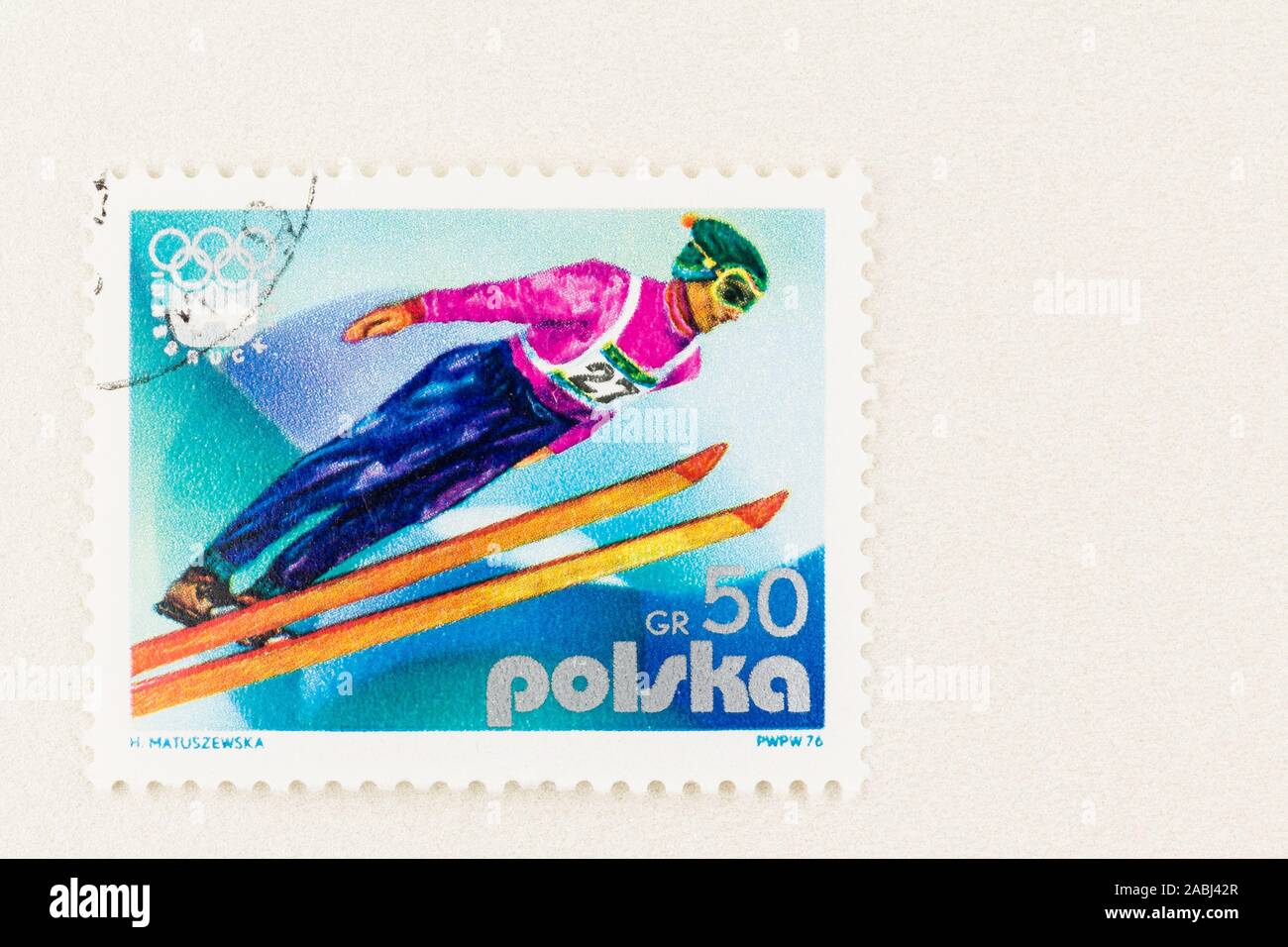 SeATTLE WASHINGTON - November 21, 2019: 1976 Stamp with Ski jumper flying through air, commemorating Innsbruck Winter Olympics  Scott # 2137. Stock Photo