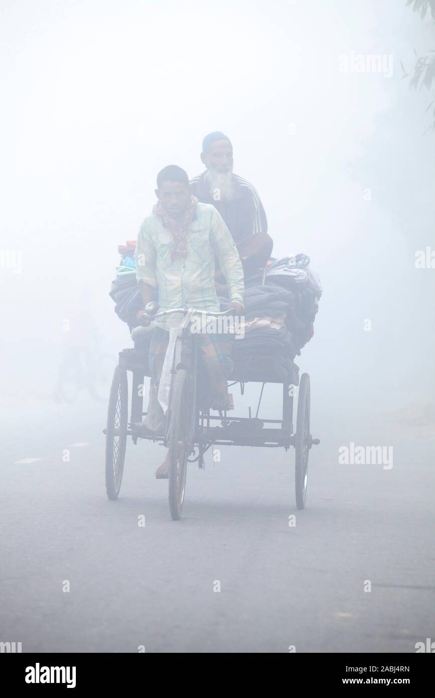 Bangladesh – January 06, 2014: On a foggy winter morning, some ...