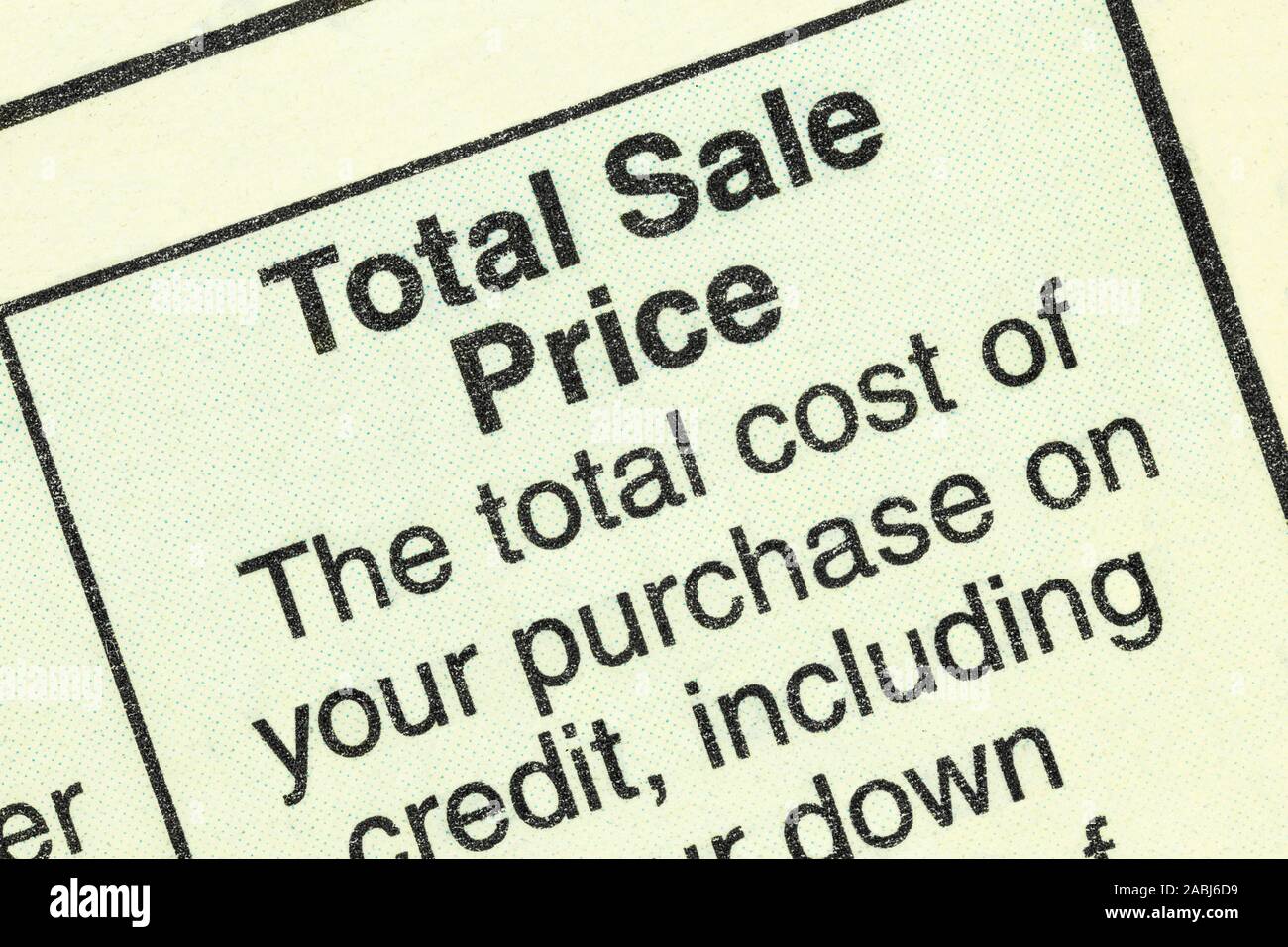 Close up macro view of total sale price detail in the standard federal truth in lending section on an automobile purchase loan form. Stock Photo