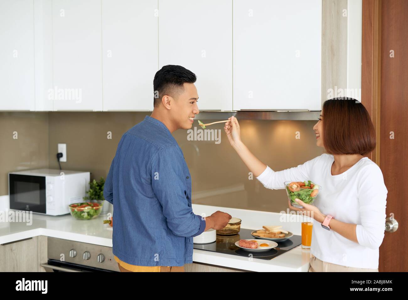 Asian Lovers Feeding Fruit And Food To Each Other, Couple And Family 