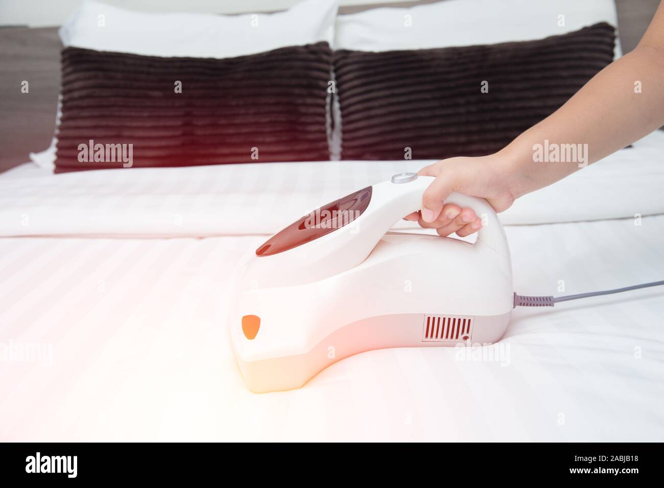 New Technology for Cleaning the mattress dust mite vacuum for clean bed Stock Photo