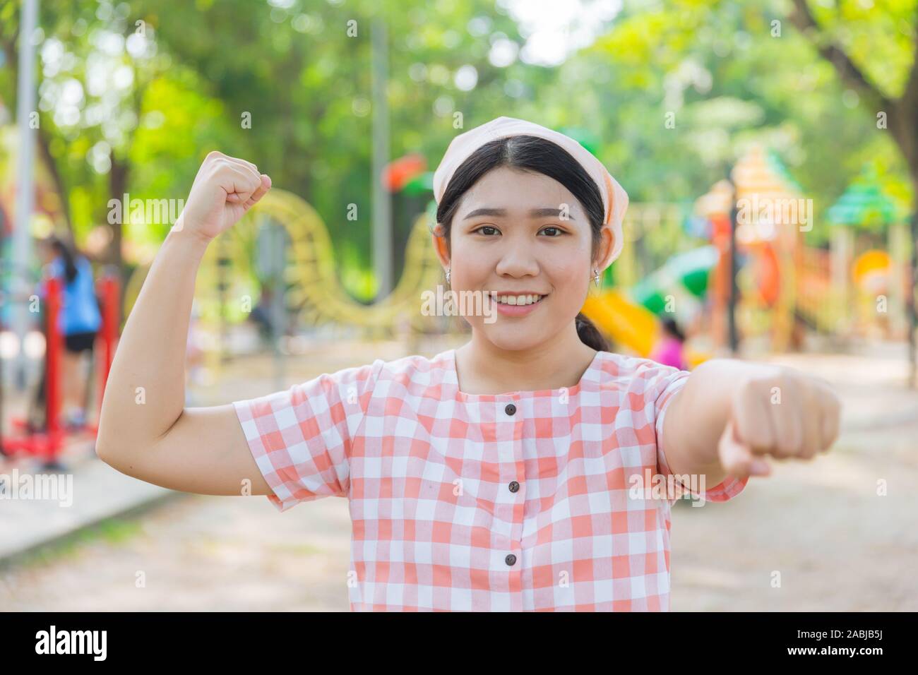 Asian overweight fat girl teen doing sport activity exercise for diet healthy outdoor. Stock Photo