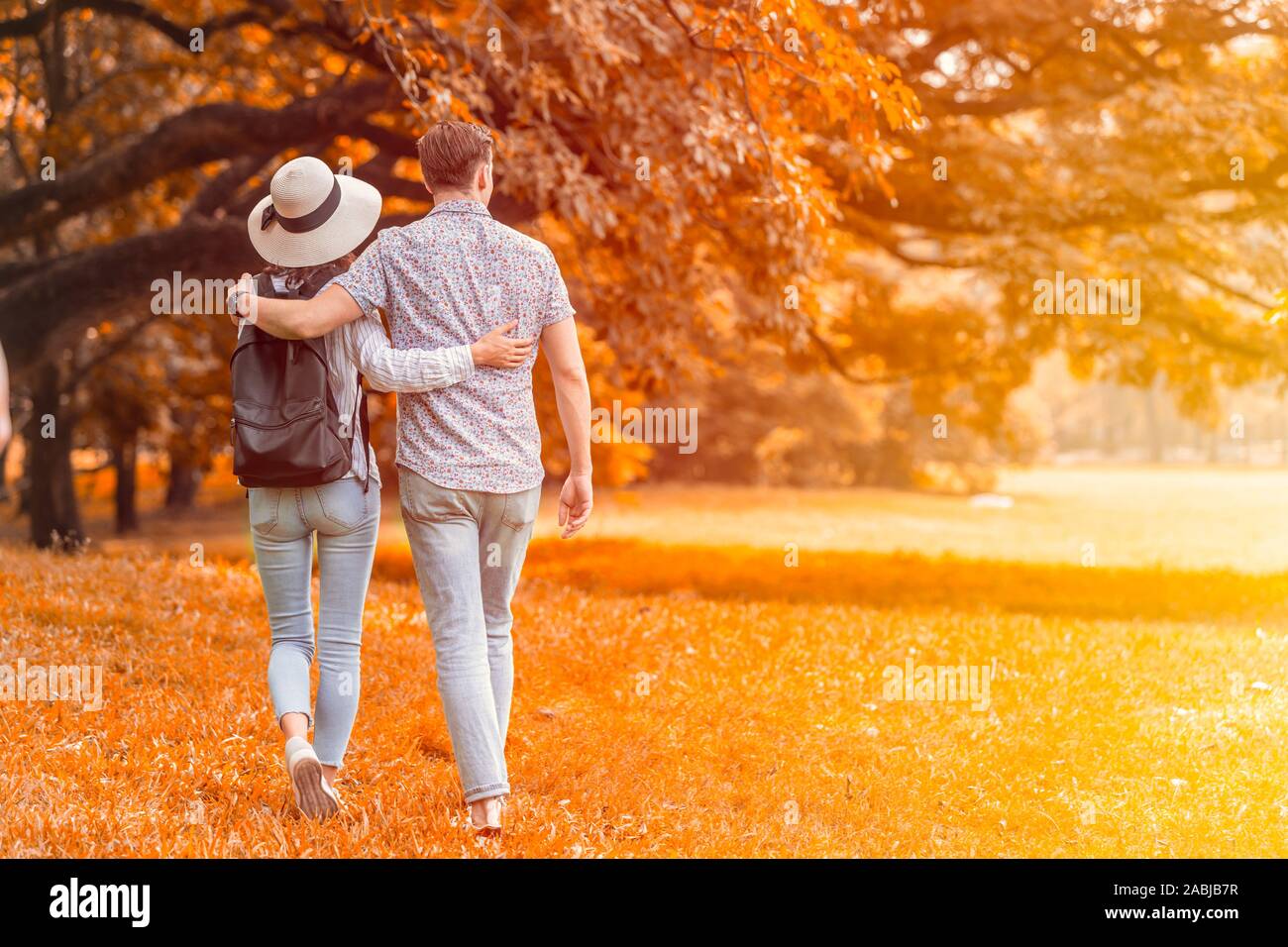 couple lover people have a good memory for walking relax in the park in autume season. Stock Photo