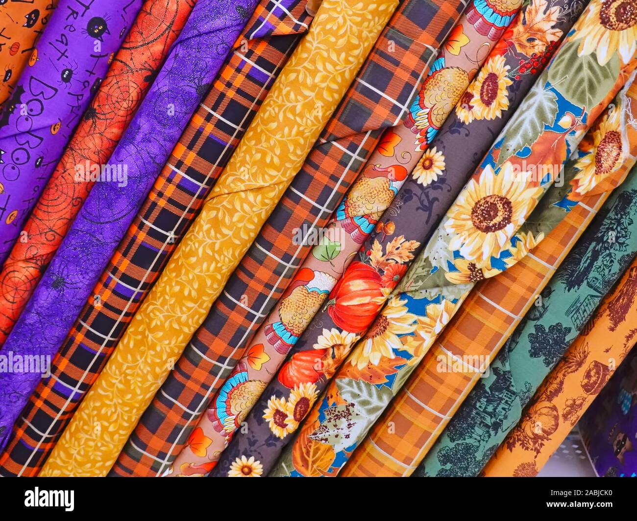 Display of Colourful Bolts of Fabric in a Fabric Store. Stock Photo