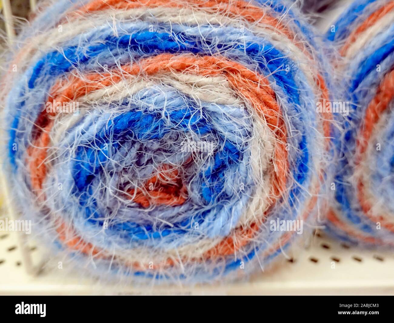 The end view of a multi-coloured skein of knitting yarn. Stock Photo