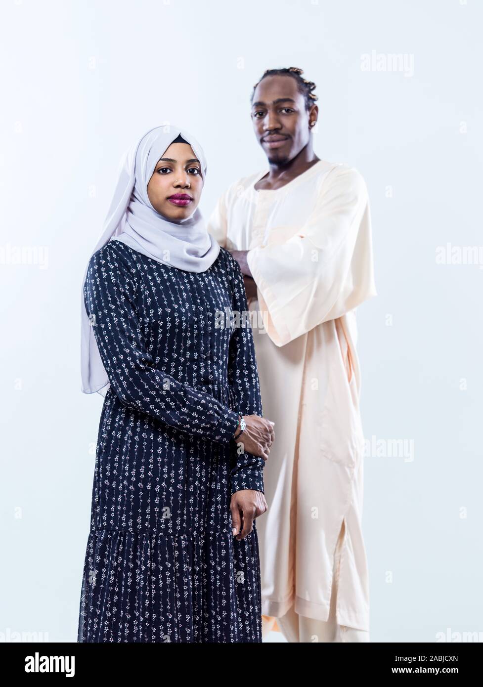 portrait of young african modern muslim couple wearing traditional ...