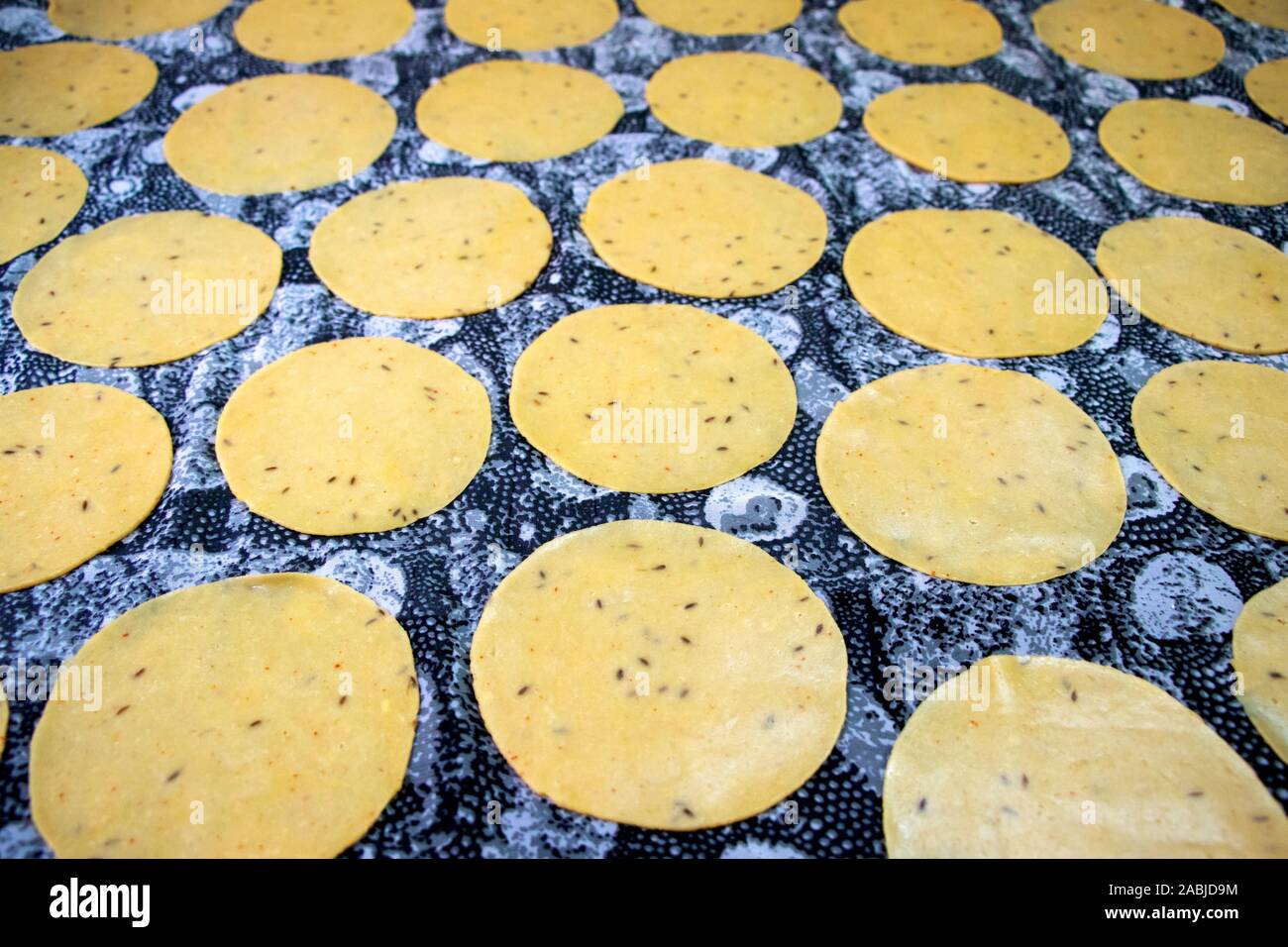 Khichiya papdi papad Rice flour crackers or Papadom drying in the sun (Chawal ke papad) Stock Photo