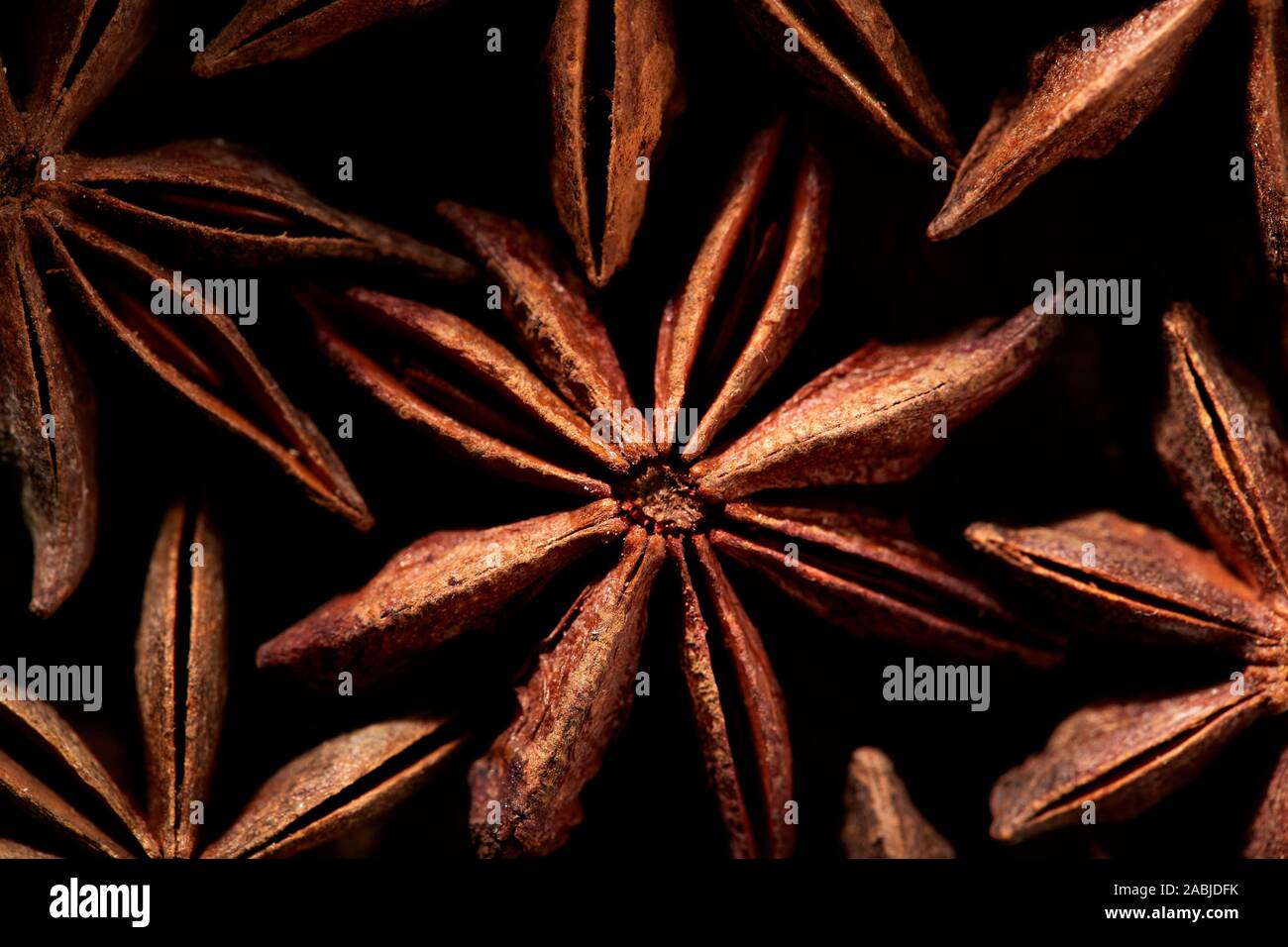 Pattern of Badyan star anise seeds close up at the market in India Stock Photo