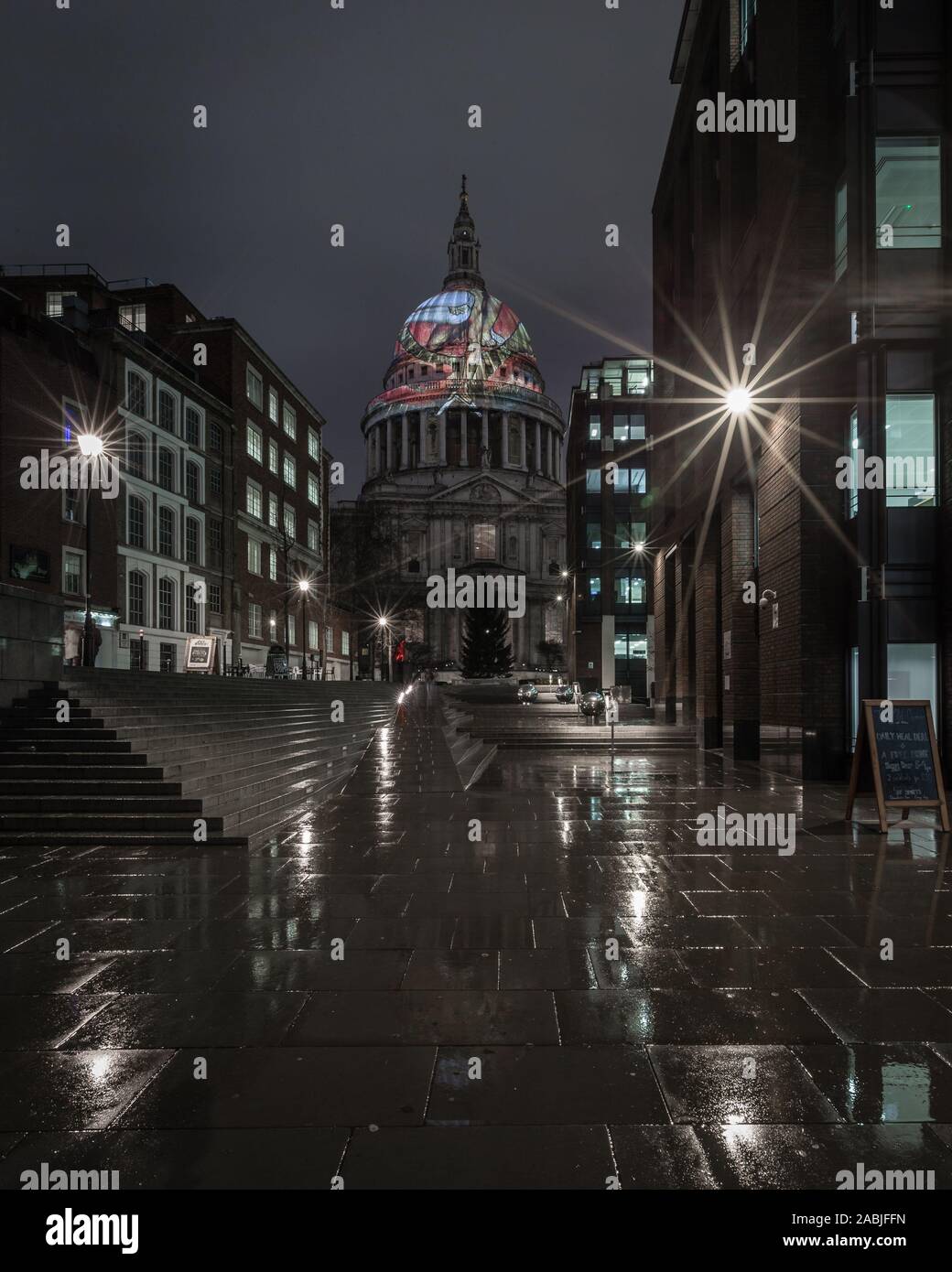 Walkway to a  view of 'Ancient of Days' by William Blake projected on to dome of St Paul's Cathedral in background Stock Photo