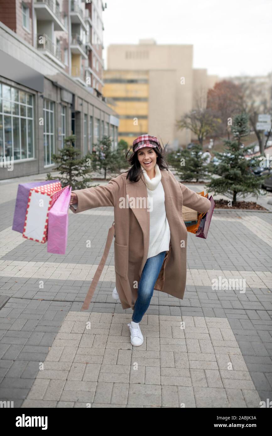 Nice happy woman holding many shopping bags Stock Photo
