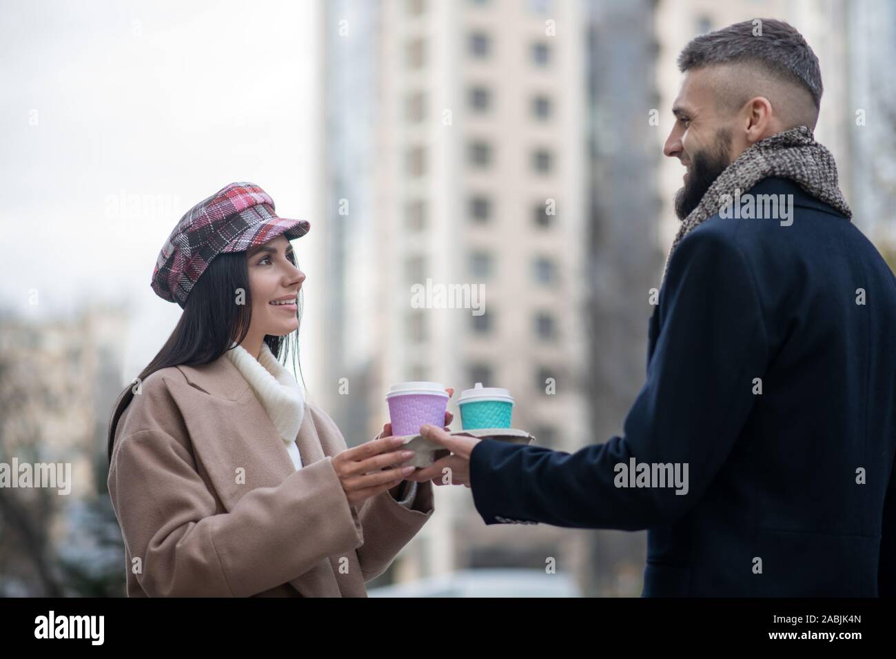 Nice young people taking cups with coffee Stock Photo