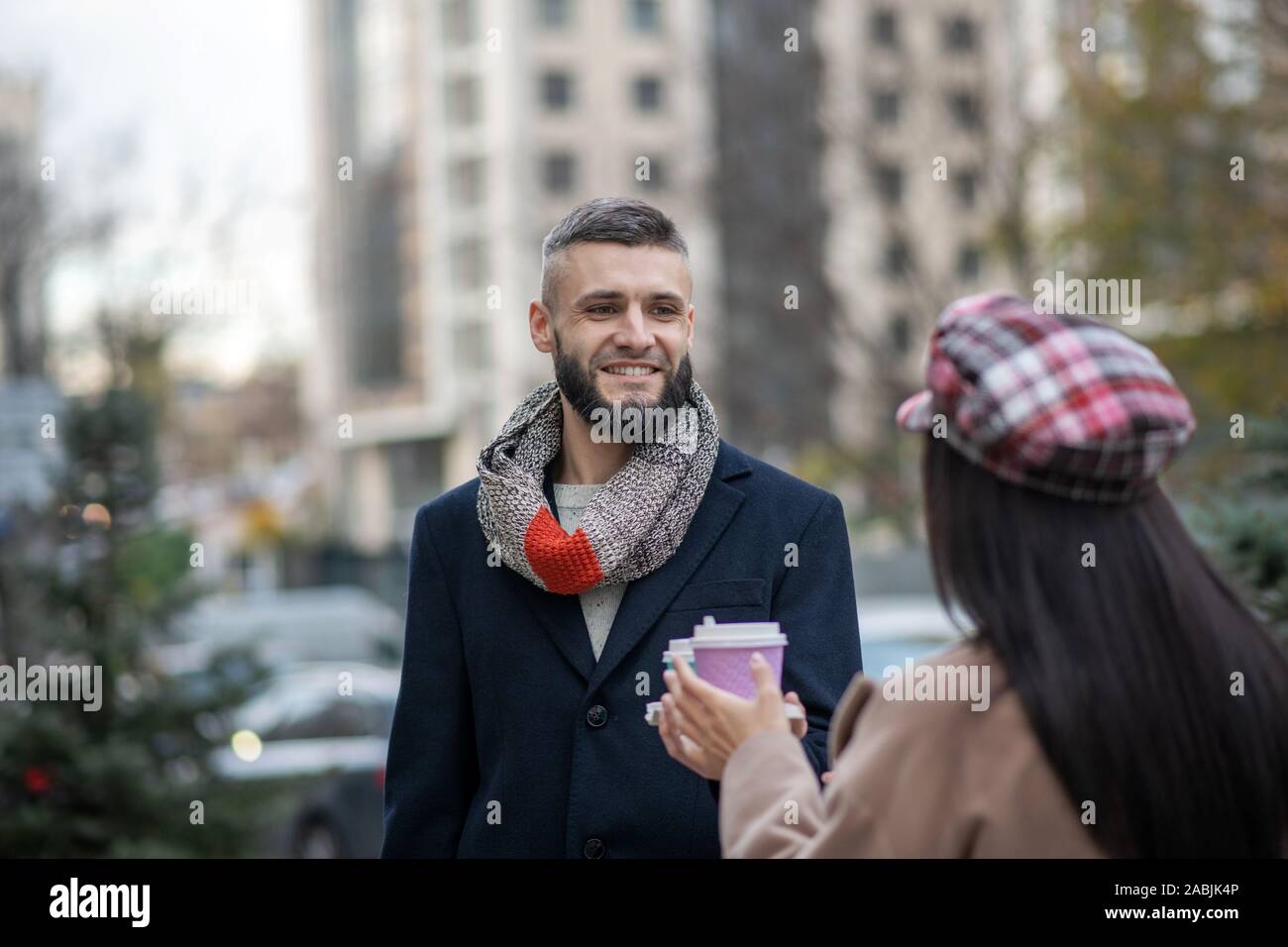 Joyful bearded man standing with his girlfriend Stock Photo