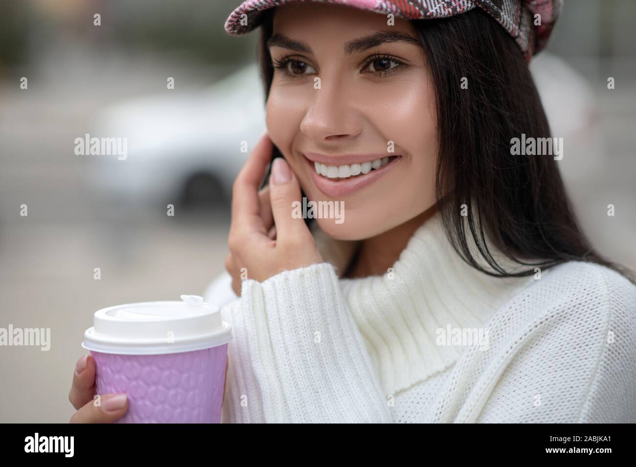 Portrait of a happy young woman with coffee Stock Photo