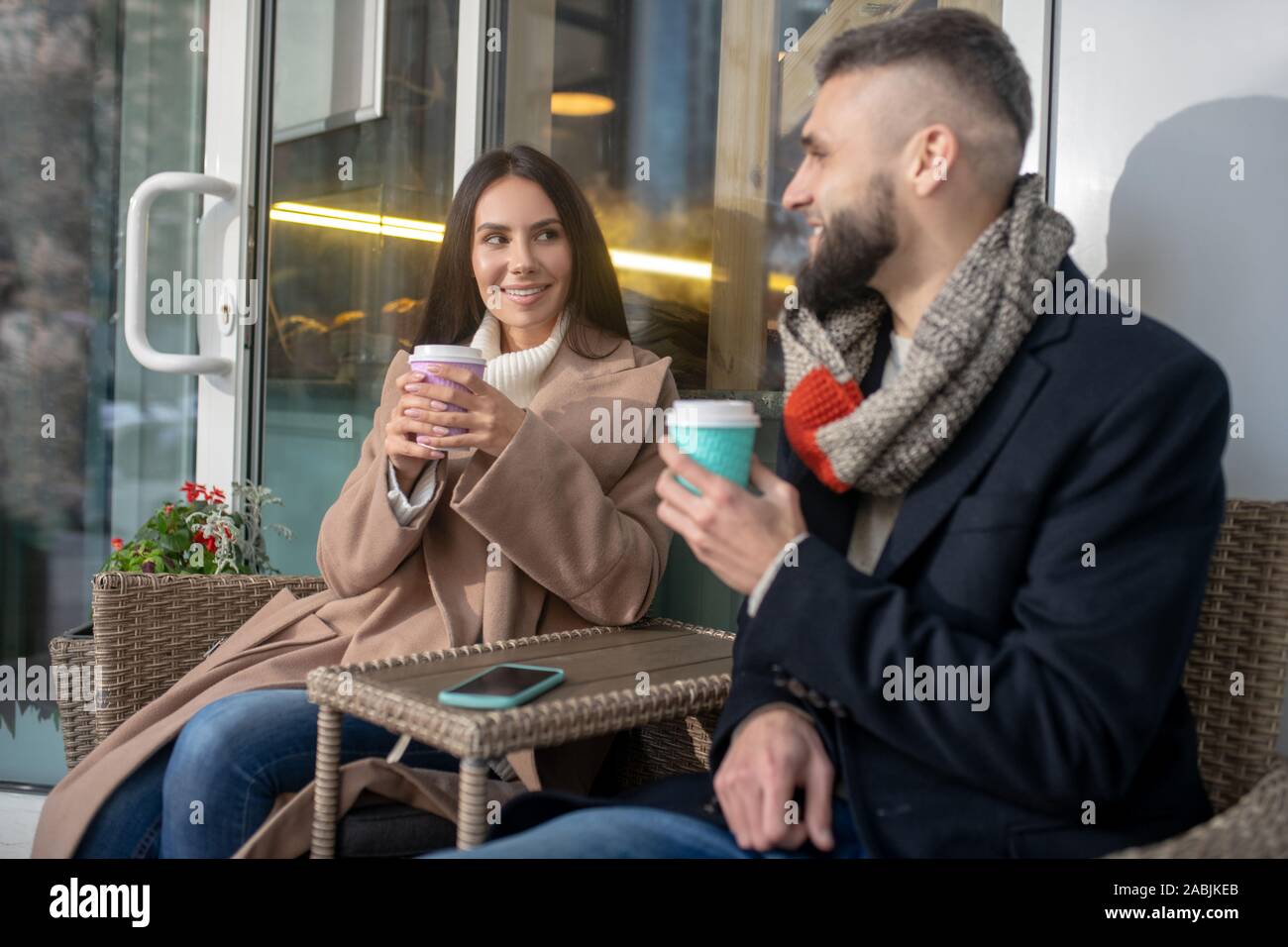 Joyful happy people having their coffee together Stock Photo