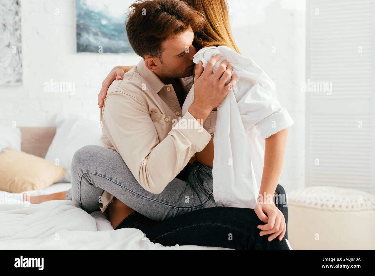 young boyfriend kissing and hugging with girlfriend in apartment Stock  Photo - Alamy