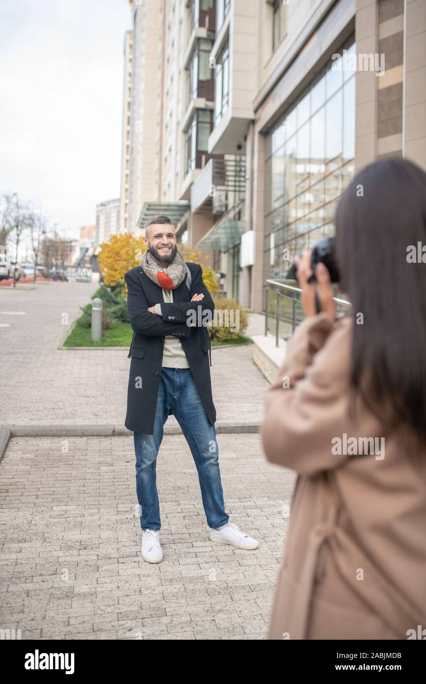 Beautiful nice woman holding a professional camera Stock Photo