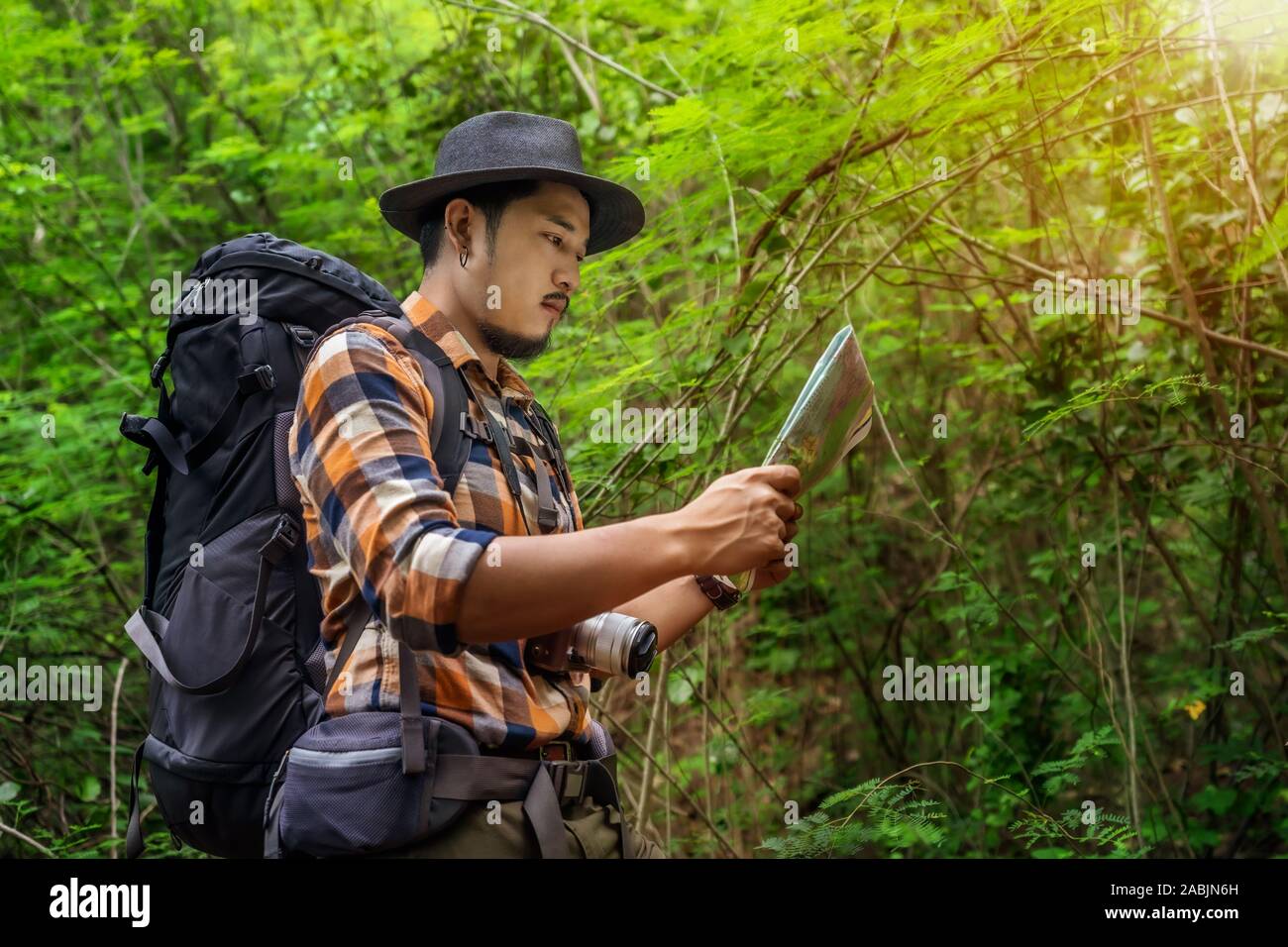 Man traveler backpack map hi-res stock photography and images - Alamy