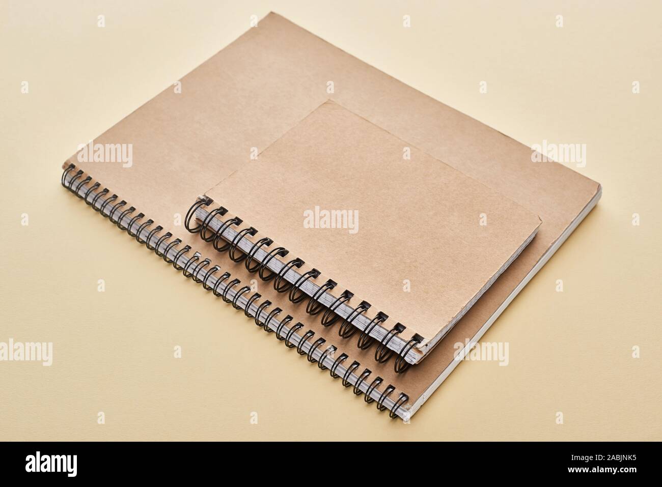 two paper blank notebooks on beige background Stock Photo - Alamy