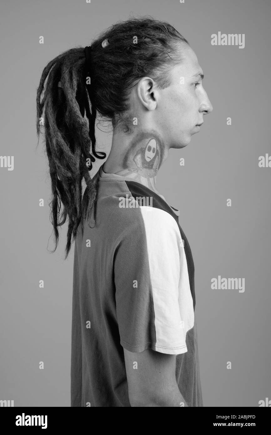 Young Man With Dreadlocks In Black And White Stock Photo