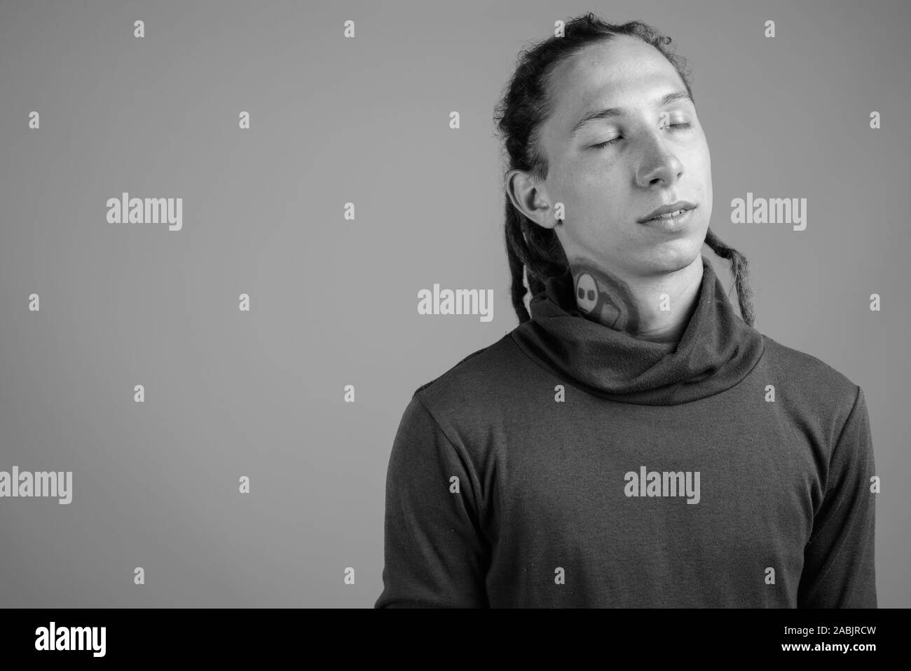 Young man with dreadlocks in black and white Stock Photo - Alamy