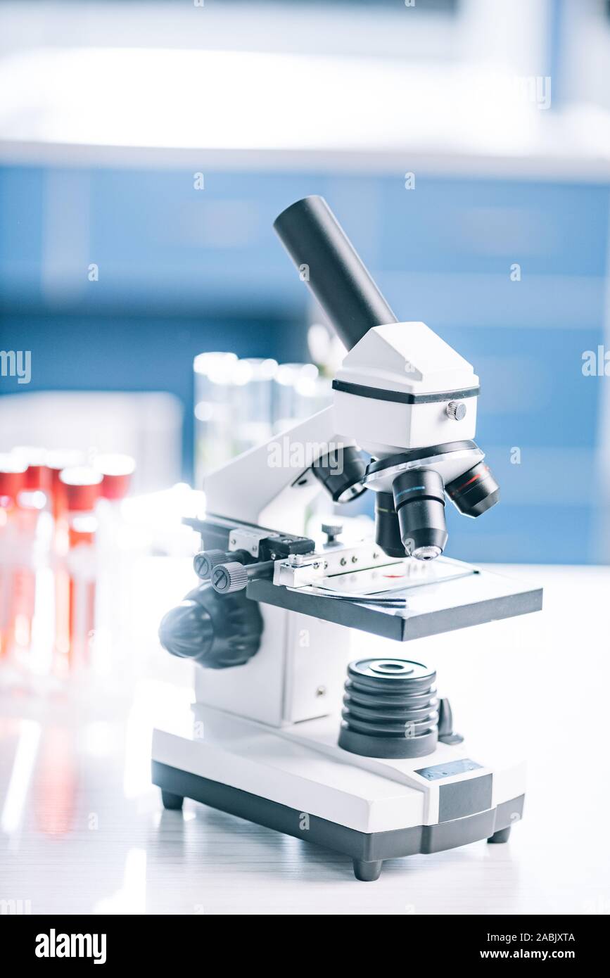 selective focus of microscope near test tubes with samples Stock Photo ...