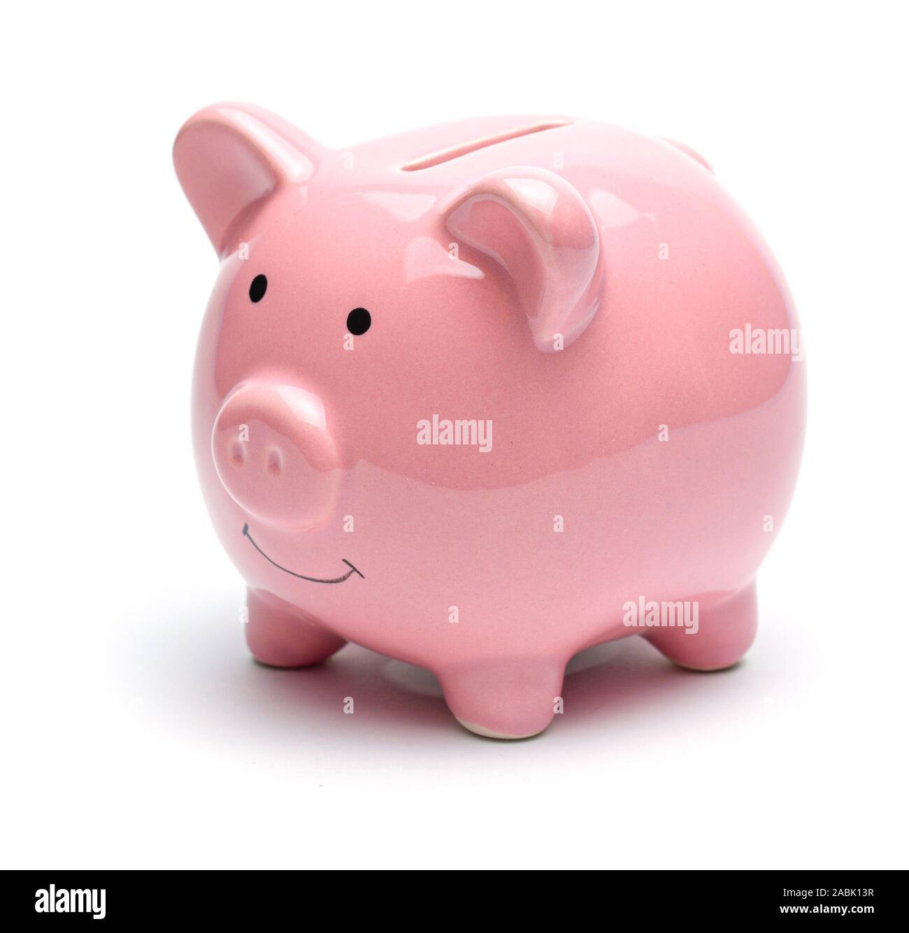 Pink piggy bank isolated on a white background Stock Photo - Alamy