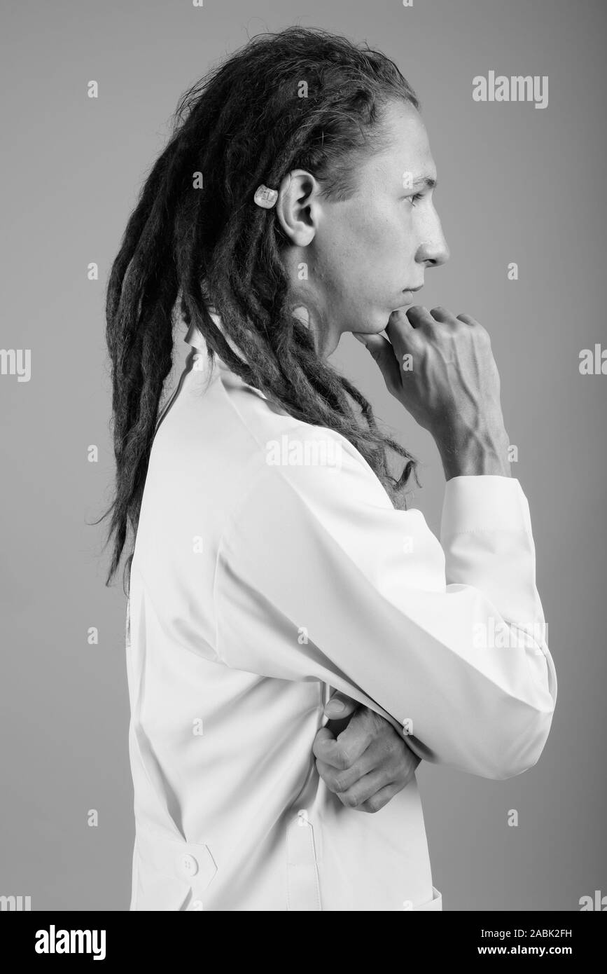Young Man Doctor With Dreadlocks In Black And White Stock