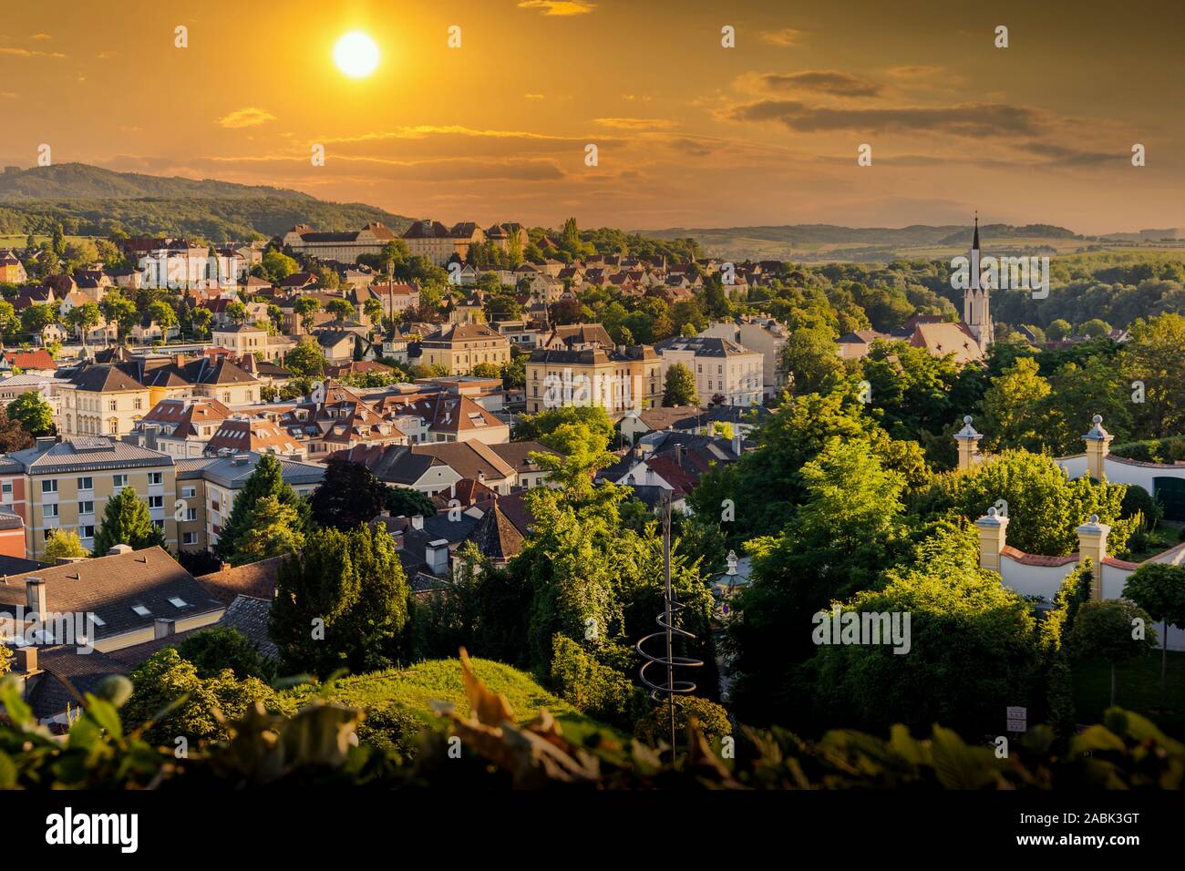 View of the buildings and roofs of the picturesque town of Melk on a sunset, Lower Austria, Wachau Valley. Stock Photo