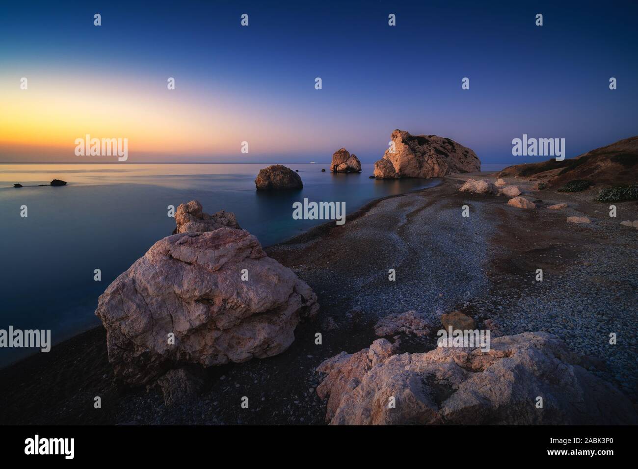 Sunrise at Petra tou Romiou - Aphrodite's rock a famous tourist travel destination landmark in Paphos, Cyprus Stock Photo