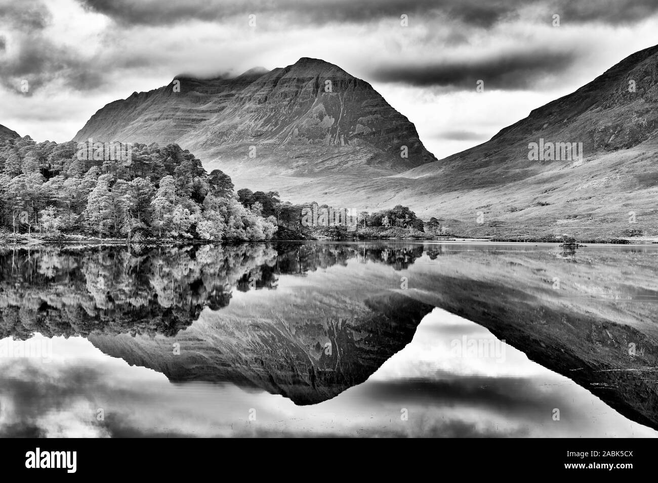 Liathach reflected in Loch Clair, Torridon, Wester Ross, Highland, Scotland.  Black and white. Stock Photo