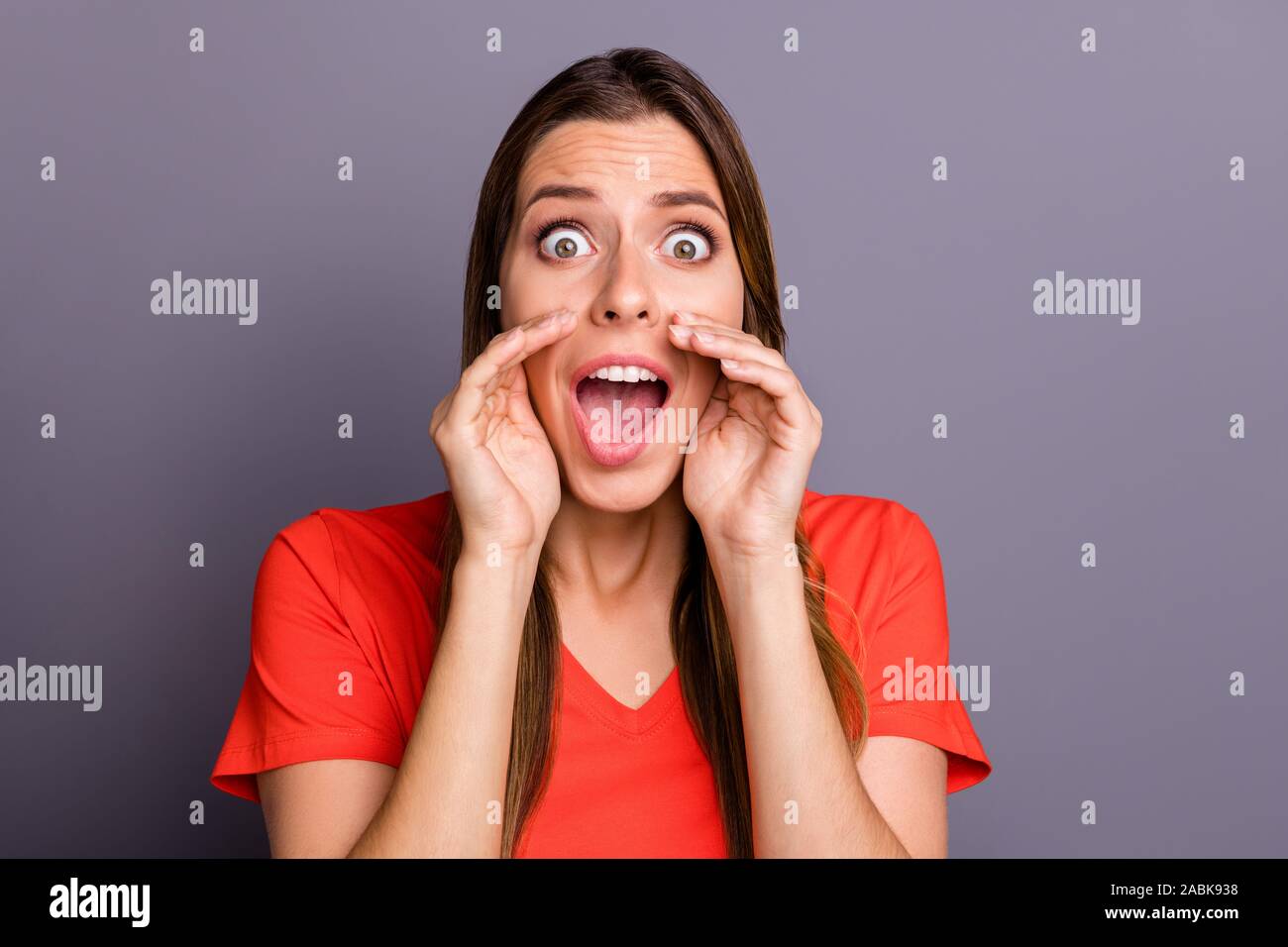Terrify Lady Photo of crazy terrified lady holding hands near mouth yelling sos ...