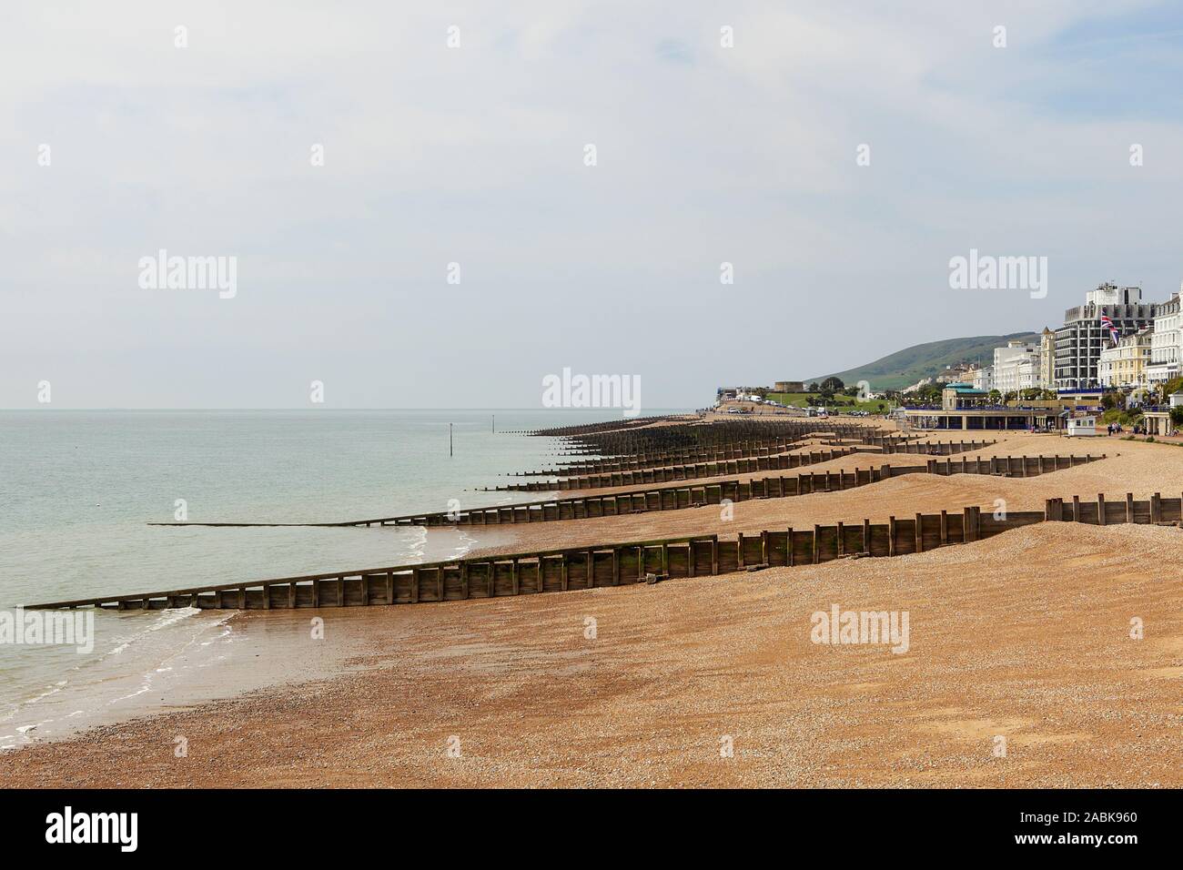 Viewed here at the western end of Eastbourne's beach are the sea defences, notably called Groynes. Stock Photo